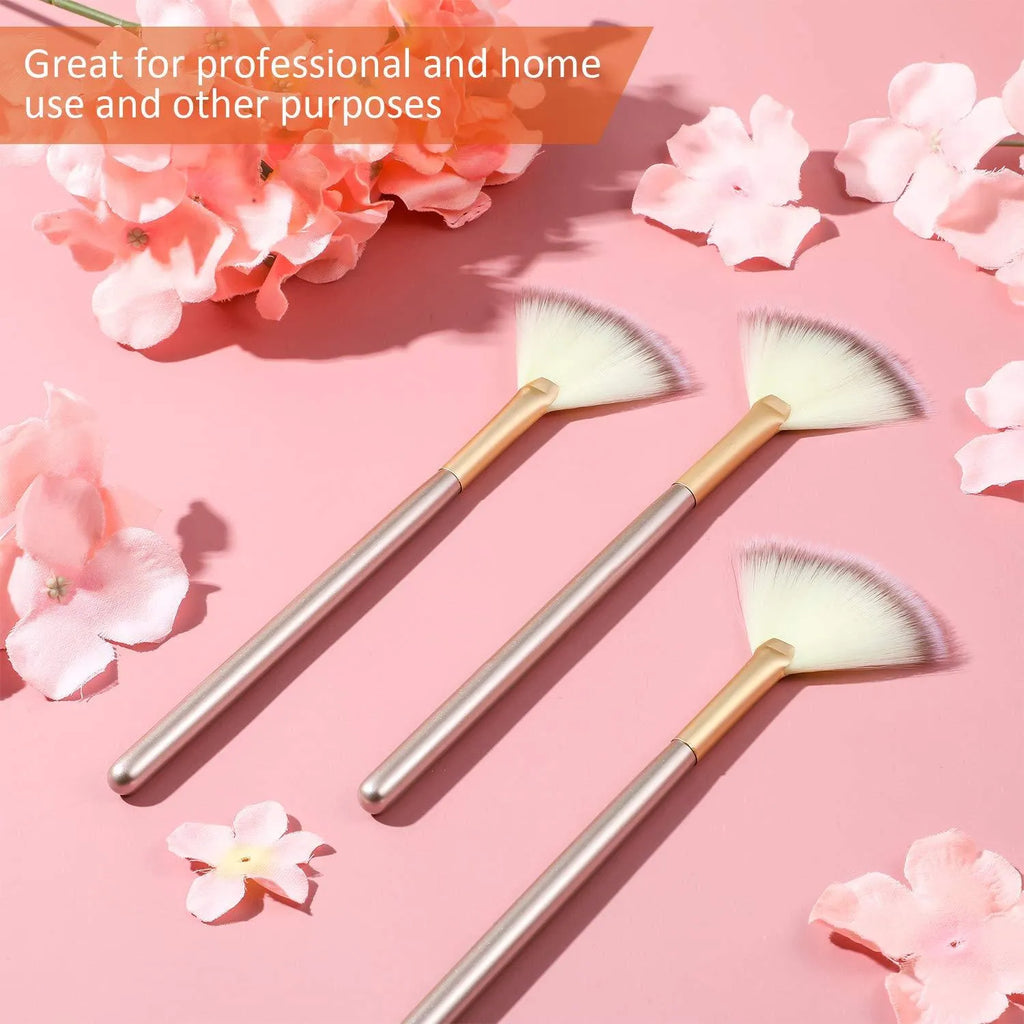 Ten champagne-coloured acrylic handle fan brushes with soft white bristles and clear protective covers.