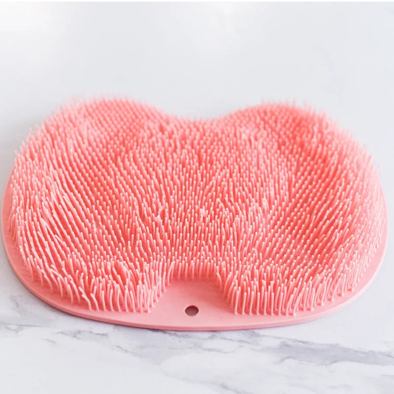 Non-slip bath mat with silicone bristles and suction cup base in a shower
