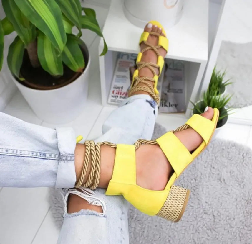 Women's suede ankle-strap sandals with thick round head and colour-matched design on a white background