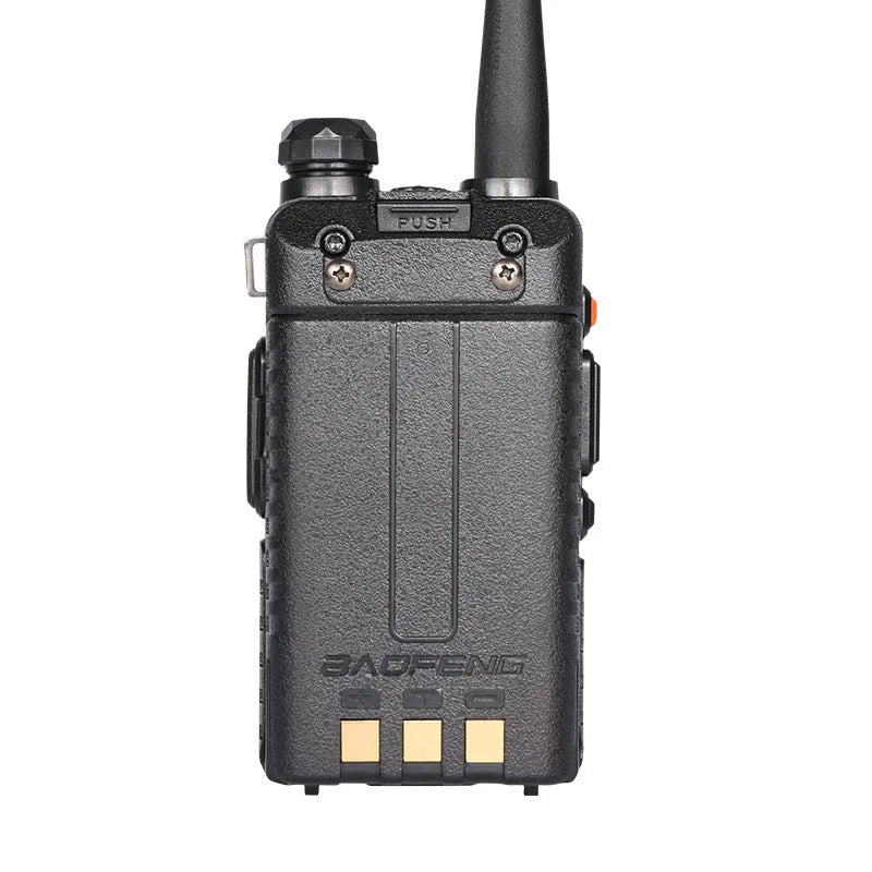 Black walkie talkie with antenna showing LCD display showing channel 1