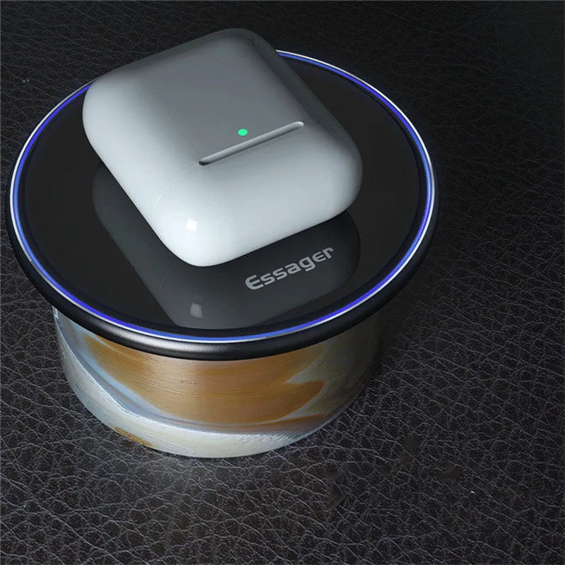 Black or white 15W Qi wireless charging pad on a table with LED light and phone charging.