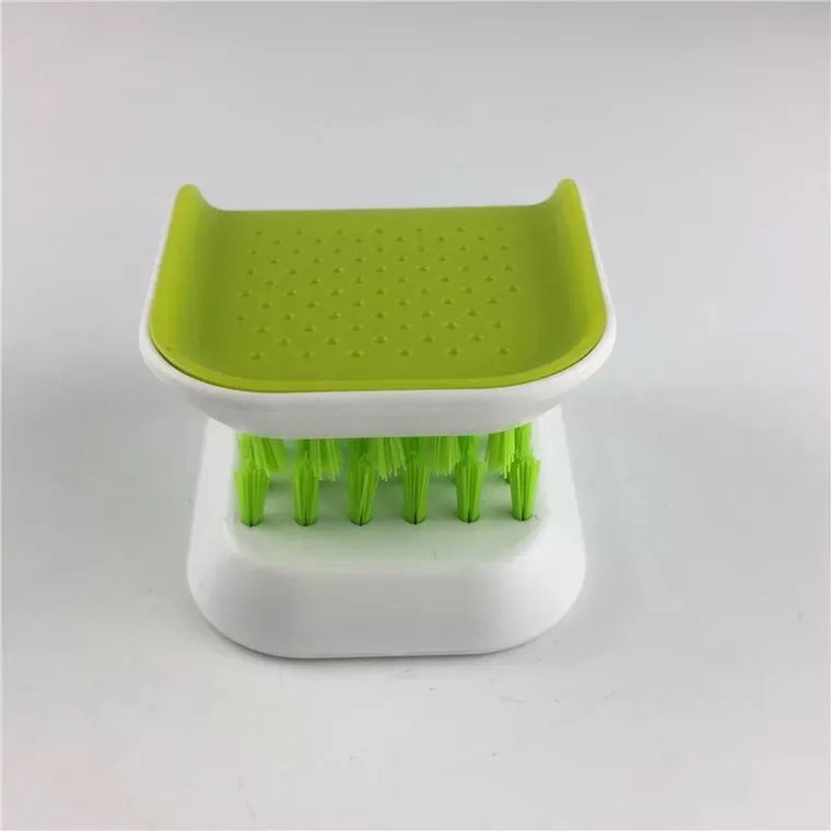 U-shaped knife and cutlery cleaner brush with ABS bristles in blue, resting on a kitchen counter