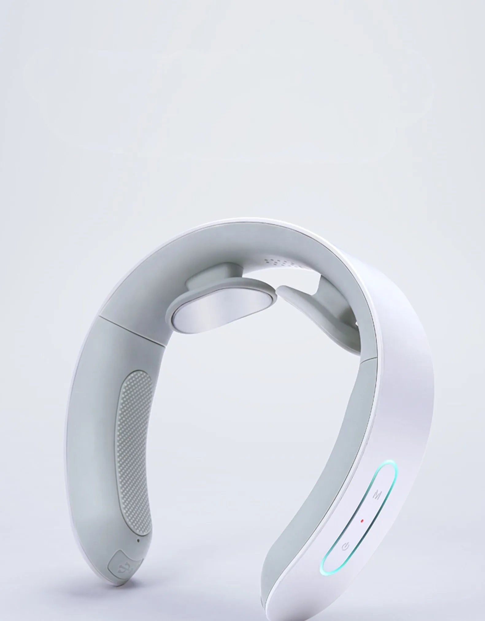 White electric acupressure massager device for neck, shoulder and back pain relief.
