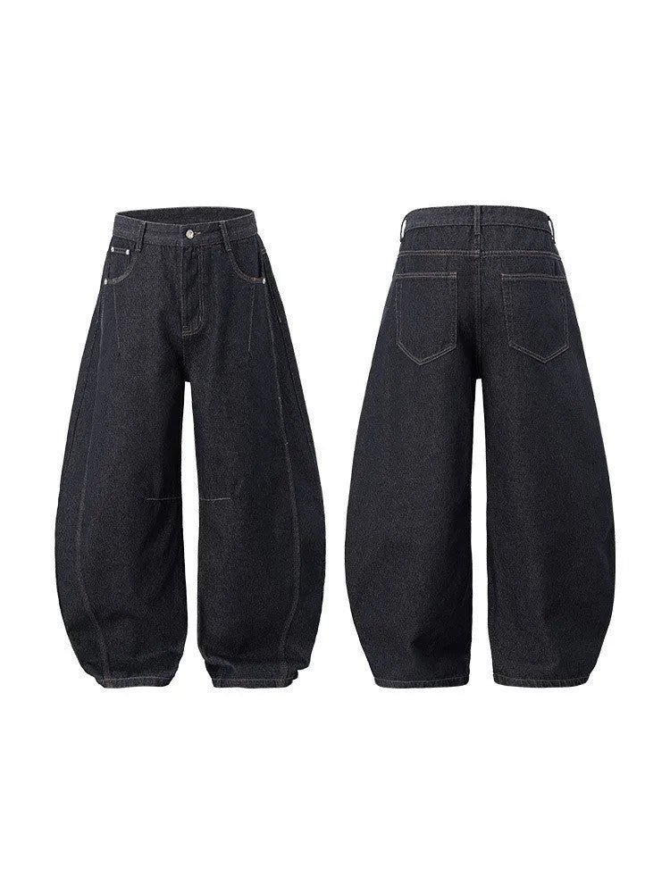 Men's original cow colour wide-leg denim trousers laid flat, showing mid-waist and full-length legs.