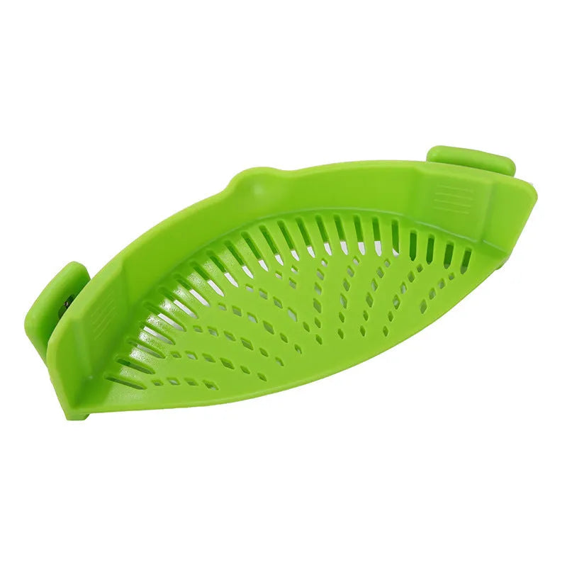 Silicone clip-on pot strainer with uniform hollow design in Red, attached to a stainless steel pot rim