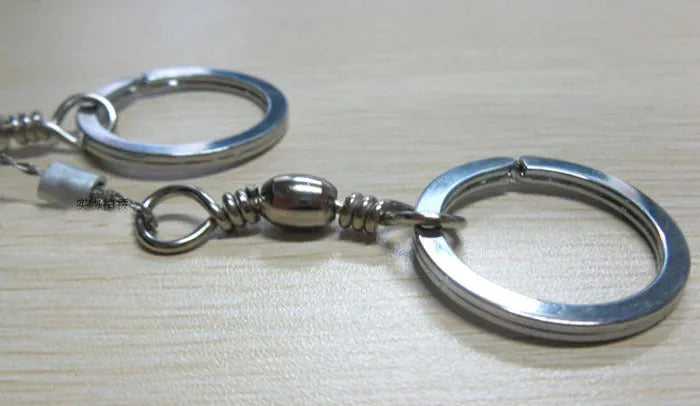 Outdoor survival wire saw with stainless steel blade, pull rings, and approximately 55cm cutting length