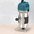Electric wood polishing trimmer 800W with aluminium casing, 2cm processing depth, on workbench