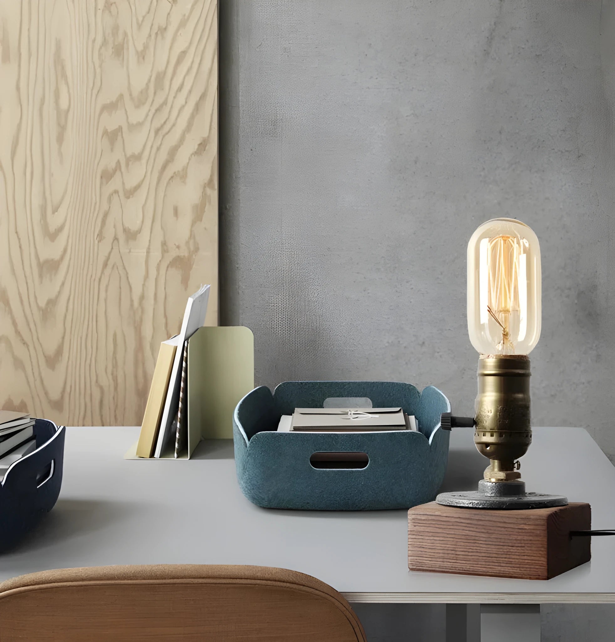 Compact wooden and iron water pipe design table lamp on a table.