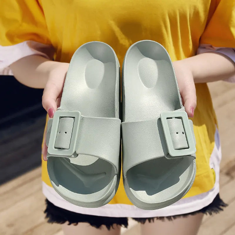 Women's grey blue EVA flip flop slippers with silver buckle closure on soft sole
