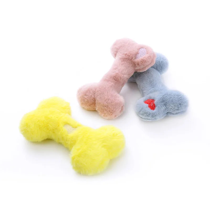 Blue plush bone dog toy with squeaker on a plain background.