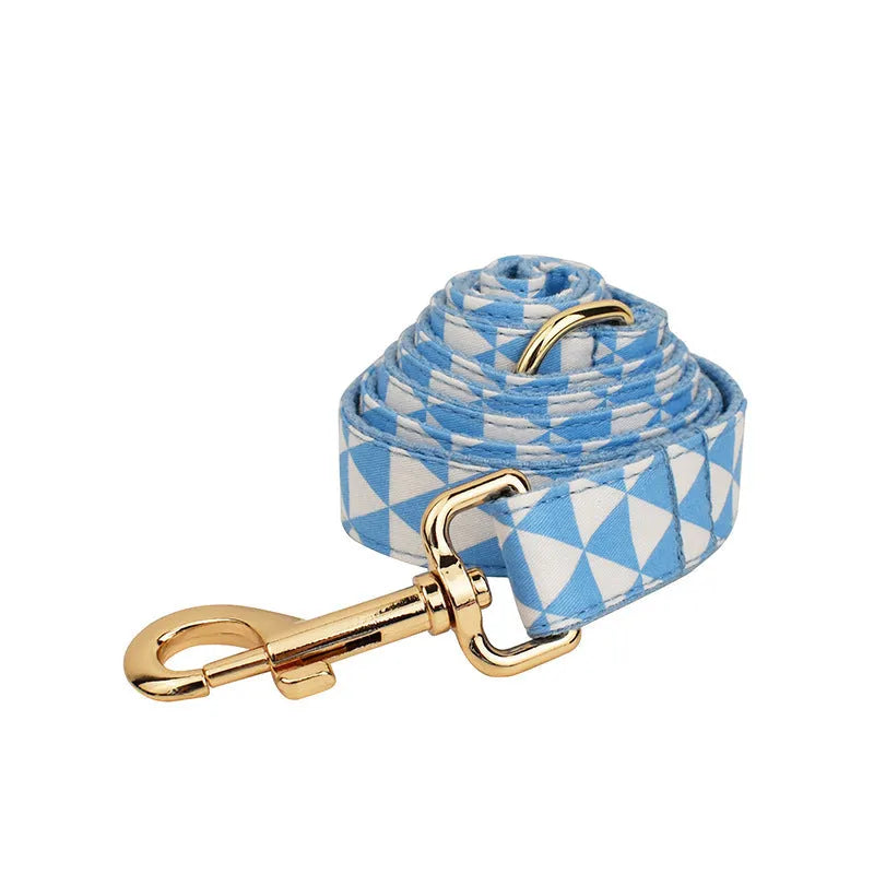 Blue triangular ring design dog vest set with matching collar, rope lead, and bow tie accessory