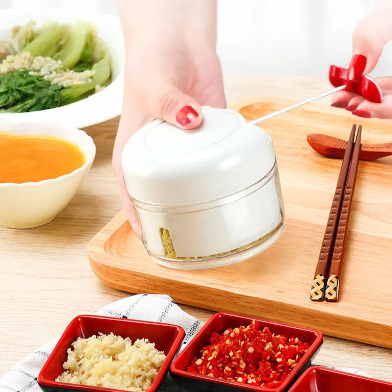 Manual cutting meat grinder with white plastic body and 304 stainless steel blade, compact size 8.5x7 cm