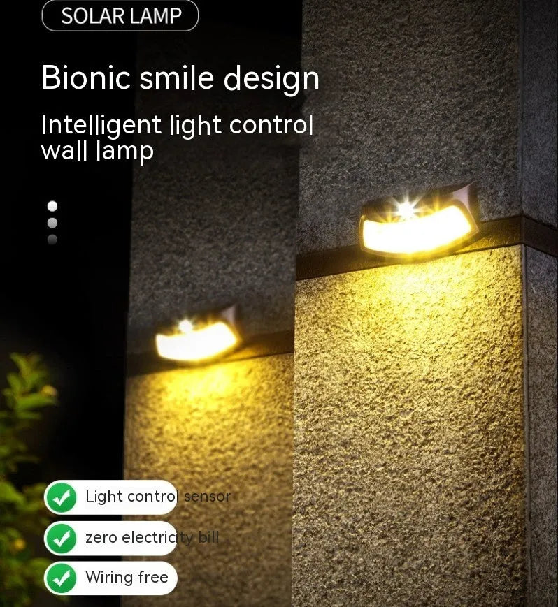 Solar powered outdoor wall lamp with smiling face design for garden and courtyard lighting