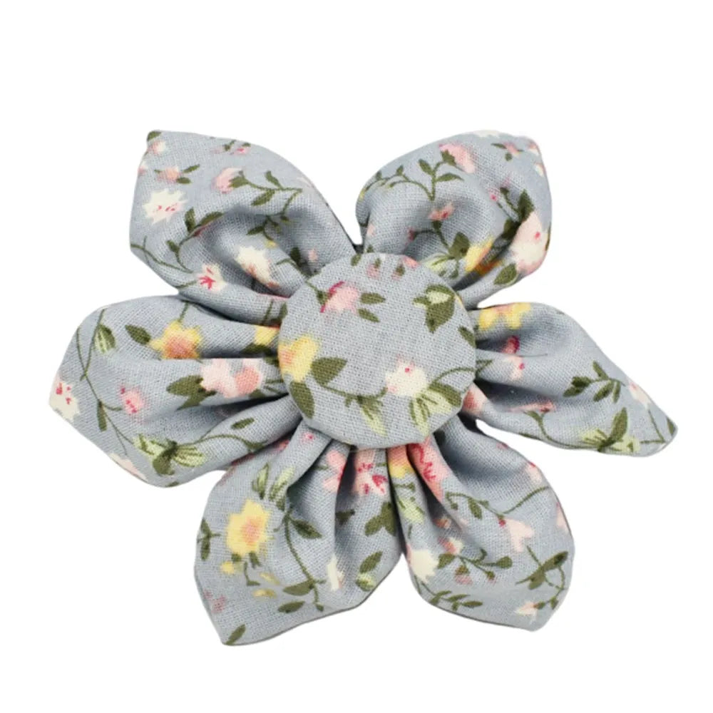 Blue floral dog collar with matching bow accessory on white background