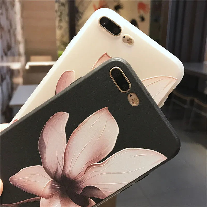 Black TPU iPhone case with embossed white flower design on back