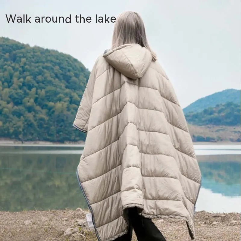 Army Green outdoor cloak sleeping bag worn as a cape, showing its 200cm length and nylon fabric.