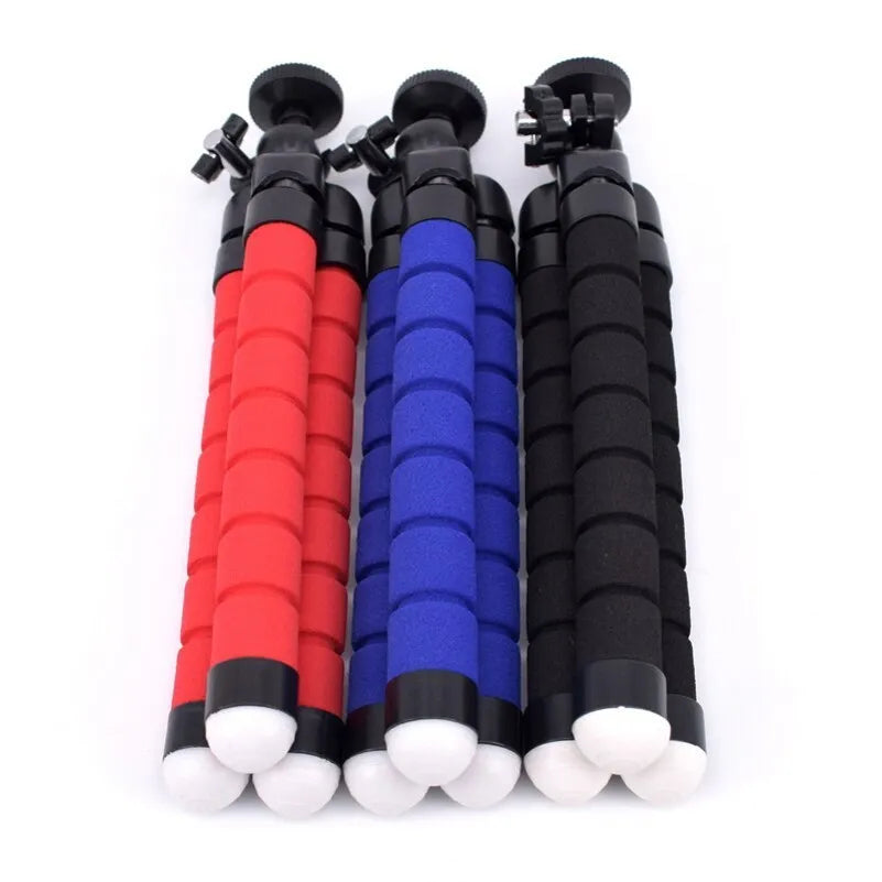 Black flexible octopus tripod wrapped around pole holding smartphone for photography