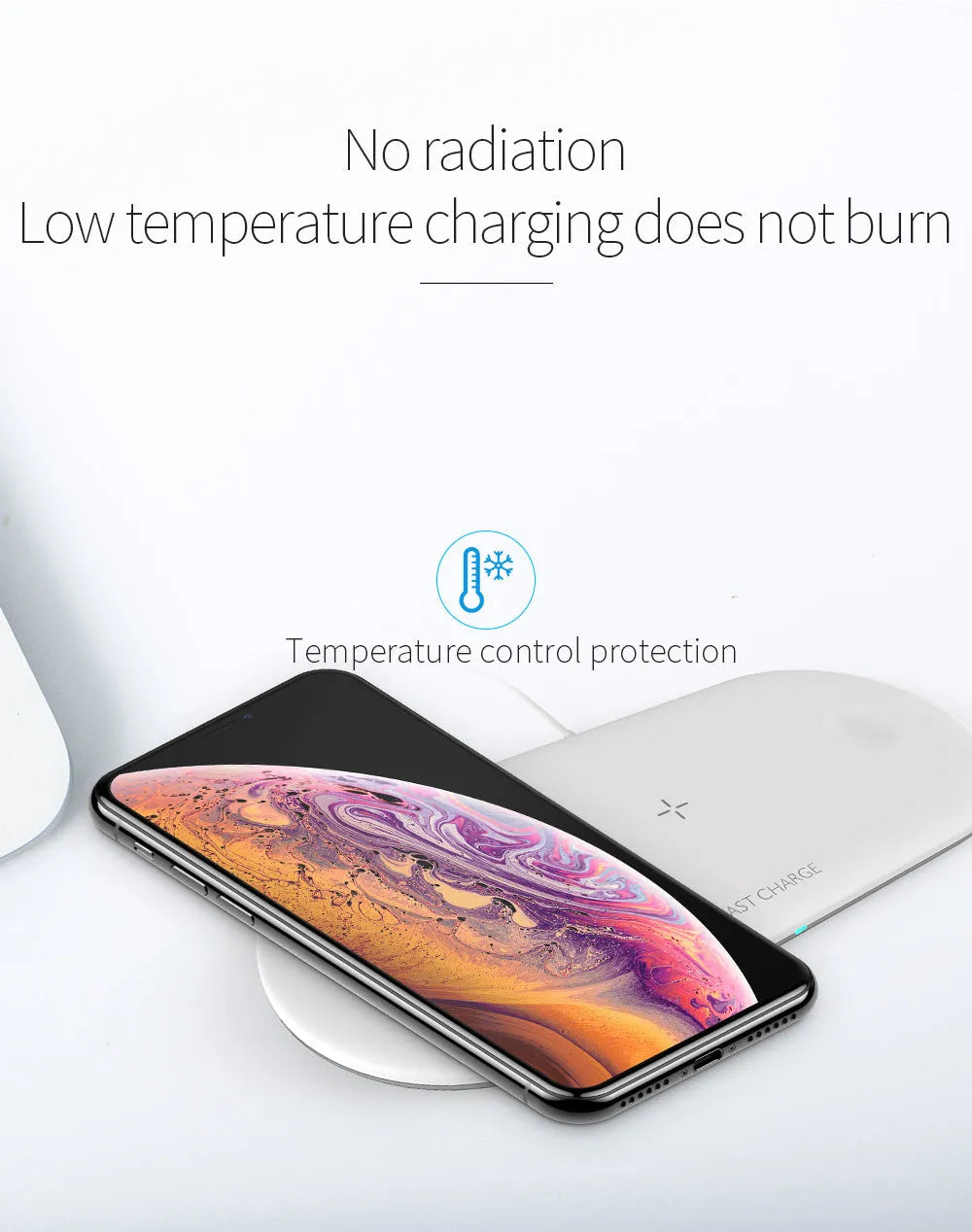 White three-in-one wireless charging station for Apple Watch, iPhone, and earbuds on a desk.