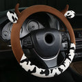 Short plush car steering wheel cover in coffee colour showing protective handle detail
