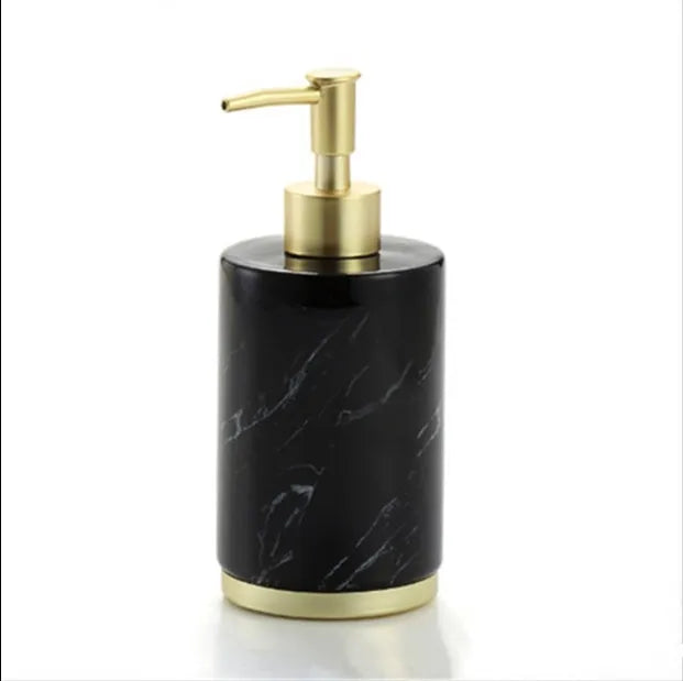 Four-piece ceramic bathroom set with bright glaze finish including bottle, cup, toothbrush holder, and soap dish