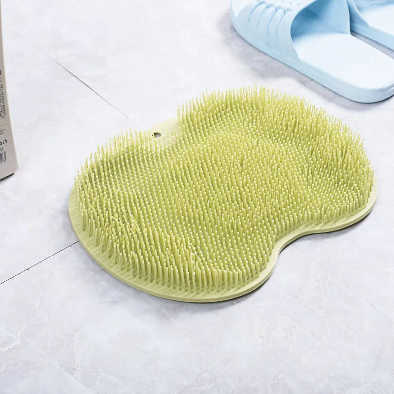 Non-slip bath mat with silicone bristles and suction cup base in a shower