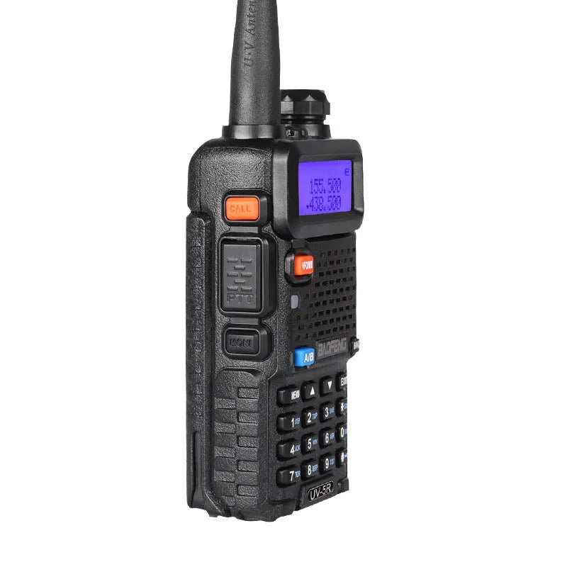 Black walkie talkie with antenna showing LCD display showing channel 1