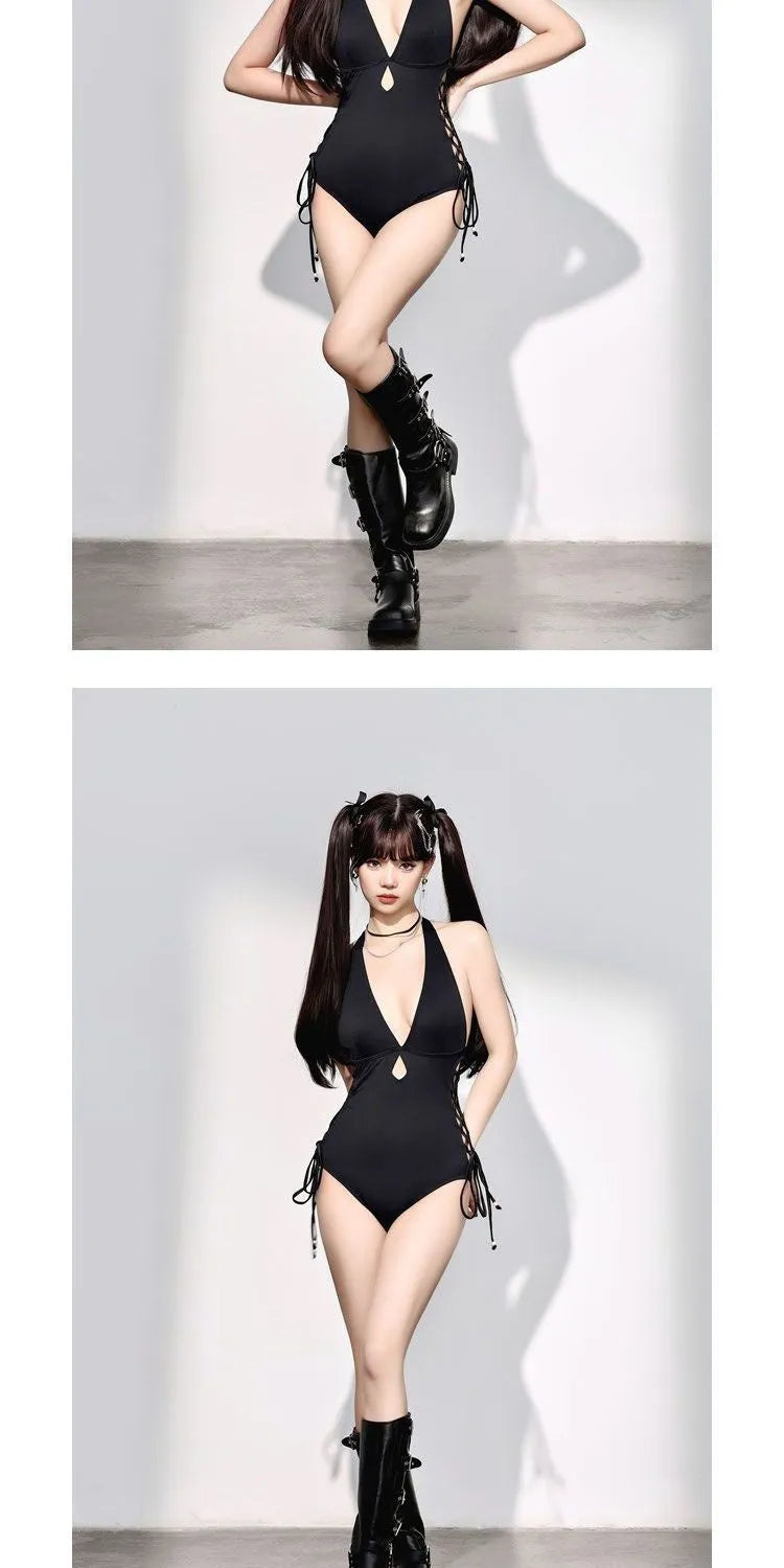 Women's black V-neck hollow strap niche one-piece swimsuit on plain background
