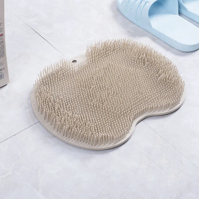 Non-slip bath mat with silicone bristles and suction cup base in a shower