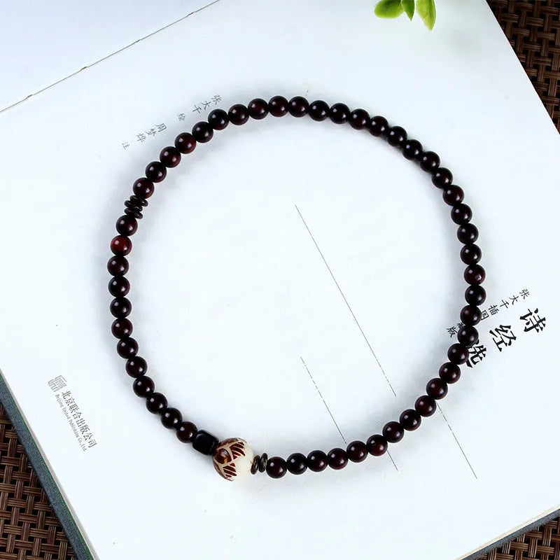 Natural rosewood double-ring bracelet with hand-knitted construction and flower-shaped beads