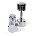 Silver pure steel dumbbell with hexagon rod handle on grey background.