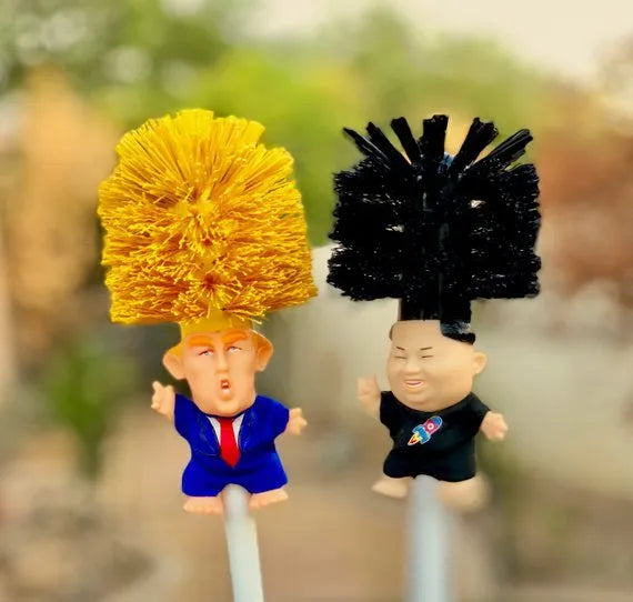Yellow plastic Donald Trump toilet brush with handle slot, 40cm length, on white background