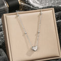 Women's titanium steel necklace with geometric pendant and ball bead chain in silver finish on white background