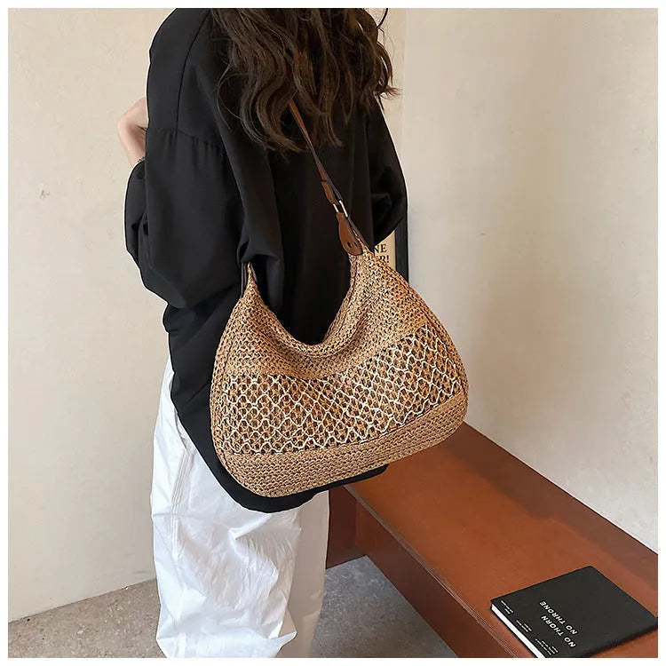 Women's casual straw cross body bag in khaki colour with a cross body strap and outer pocket.