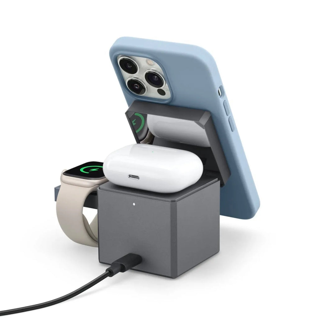 Foldable magnetic suction wireless charger charging iPhone AirPods and Apple Watch 3 on a desk with LED indicator