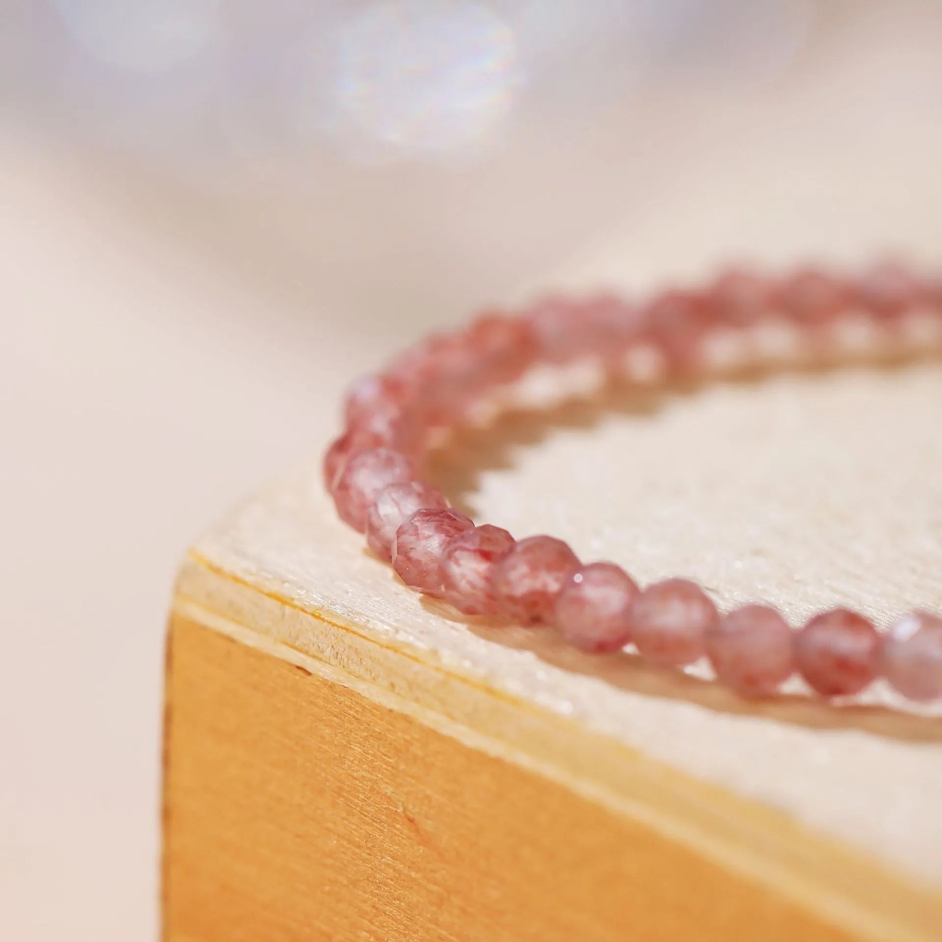 Natural strawberry quartz crystal bracelet with 3mm diamond-cut beads on adjustable cord