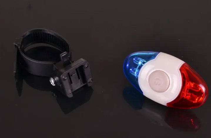 Red and blue LED bicycle tail light with an adjustable mounting base.