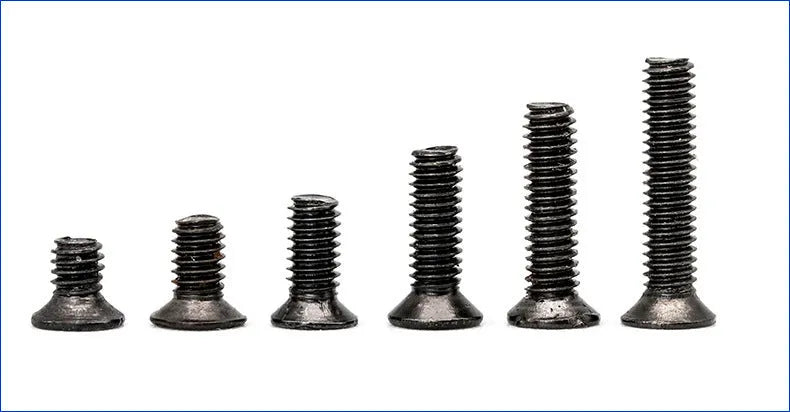 Flat head machine screw set carbon steel black plating 1.4mm diameter 16mm length on workbench