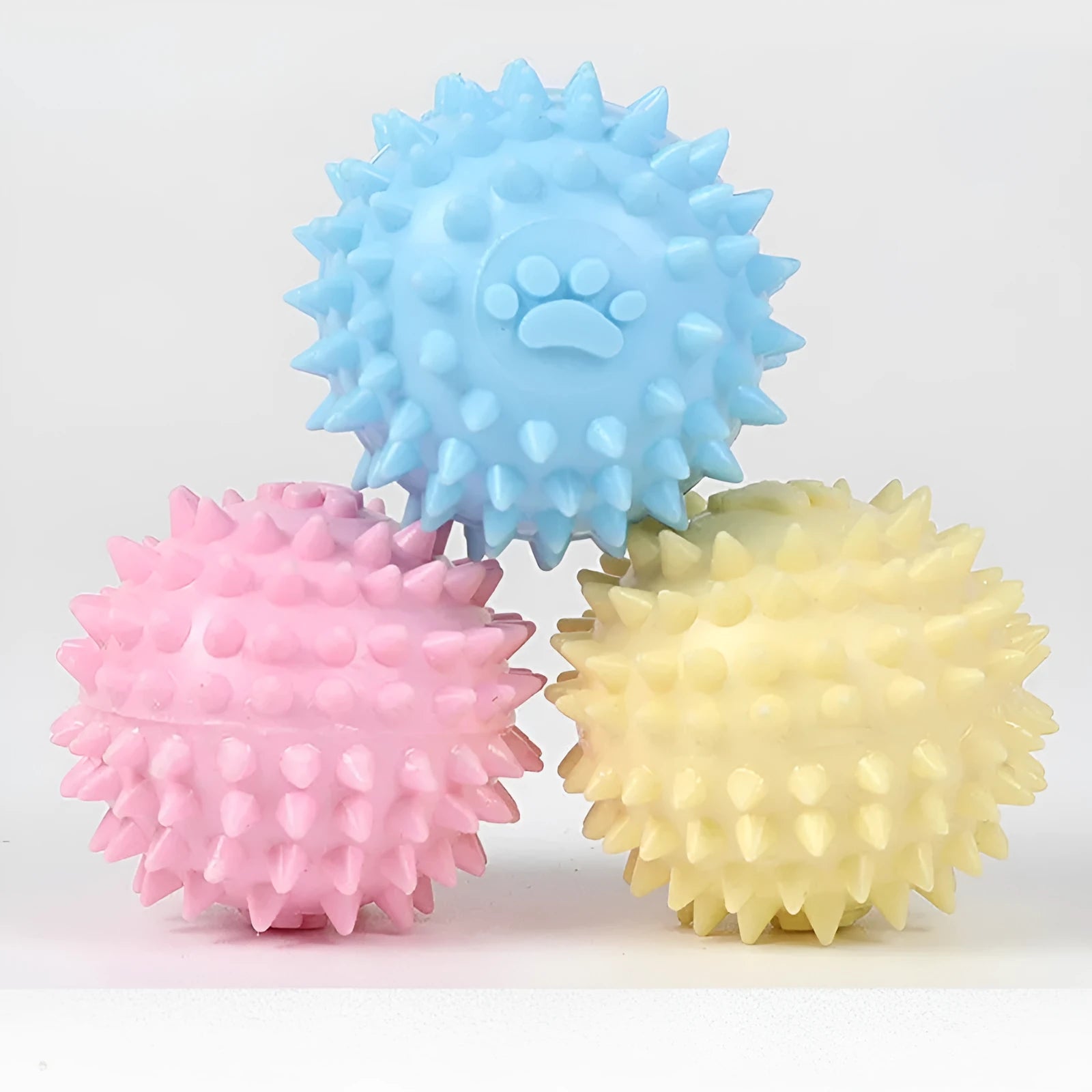 Blue TPR rubber dog chewing ball with textured footprint pattern for tooth cleaning