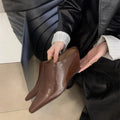 Wind wedge closed toe half slippers for women in PU upper, available in Black, Brown, and Off White
