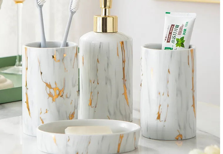 White ceramic marble effect bathroom wash kit with two cups, latex bottle, and soap box in colour box