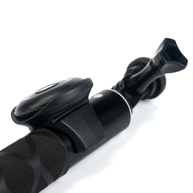 Black Bluetooth remote control for selfies and photography showing compact design