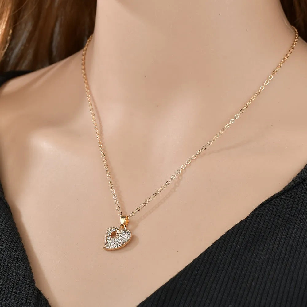 Gold electroplated alloy jewellery set showing earrings, pendant decoration, and hand decoration accessories