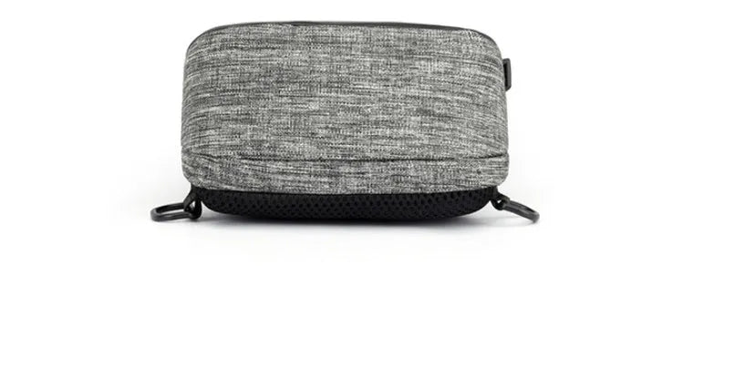 Small dark blue waterproof oxford cloth chest bag showing front zipper closure and strap