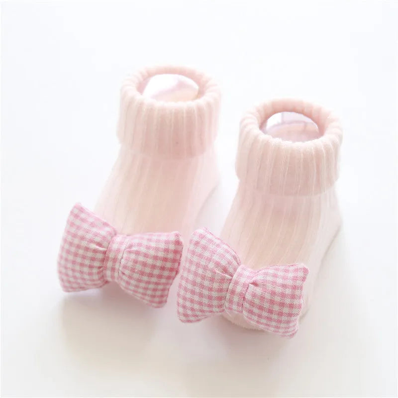Cotton baby floor socks in multiple patterns including blue bow and lion designs