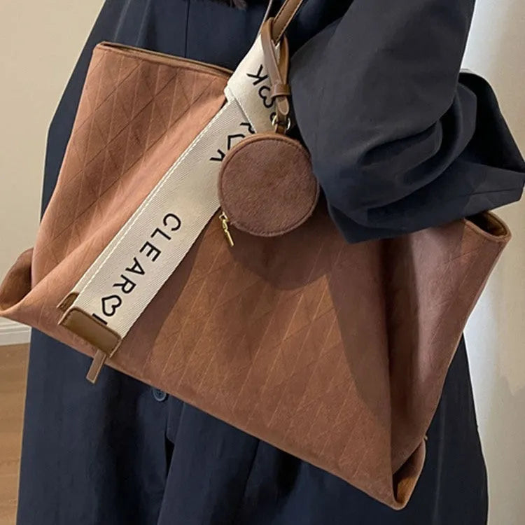 Soft polyester large tote shoulder bag in horizontal square shape with zippered pocket.