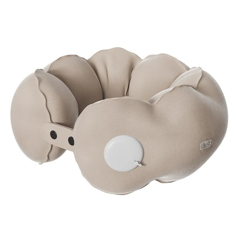 Portable inflatable cloud bubble U-shaped travel neck pillow deflated on a surface showing cartoon design