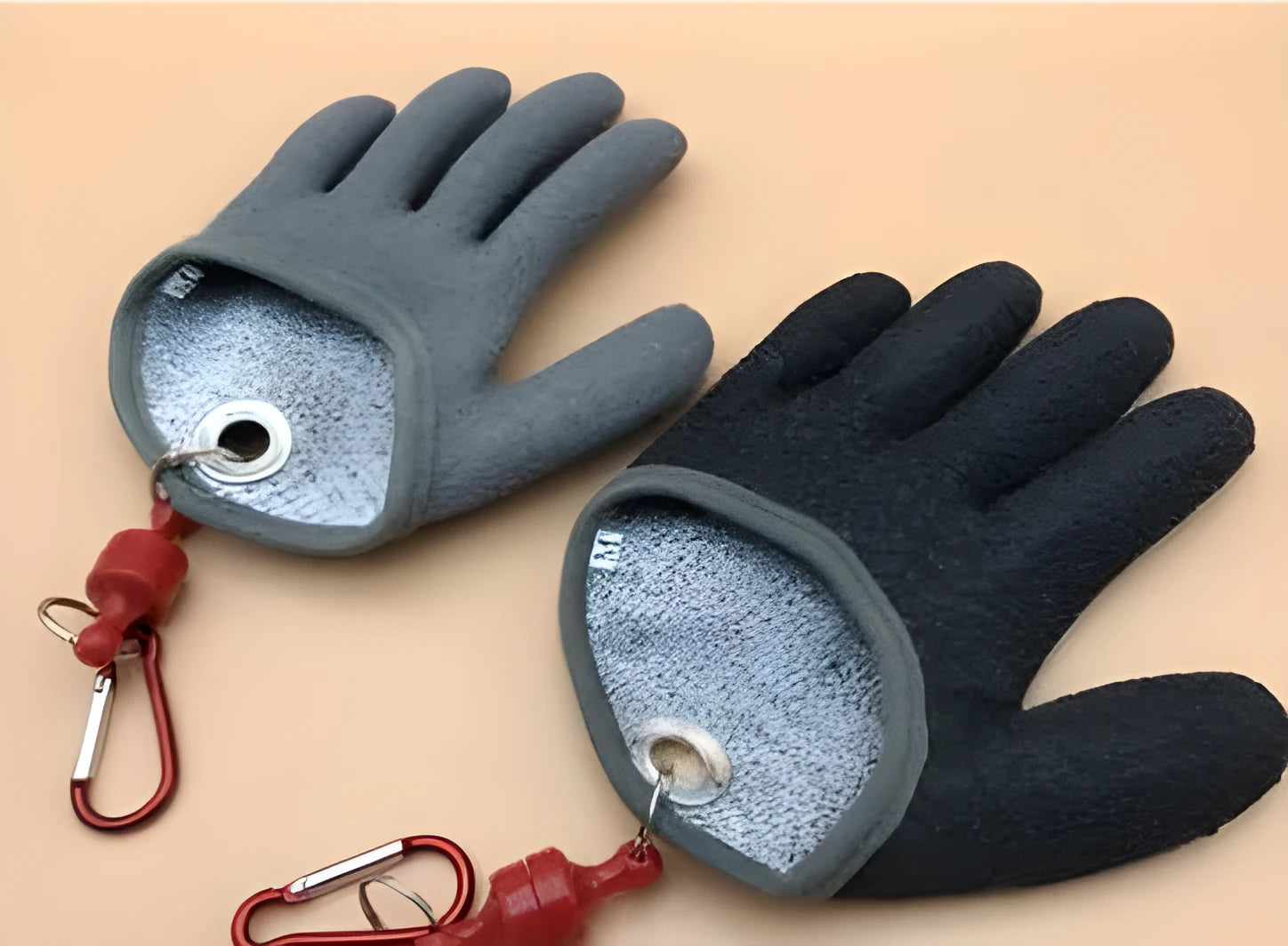 Black fish catching gloves on a pair of hands, size L, for secure fish handling