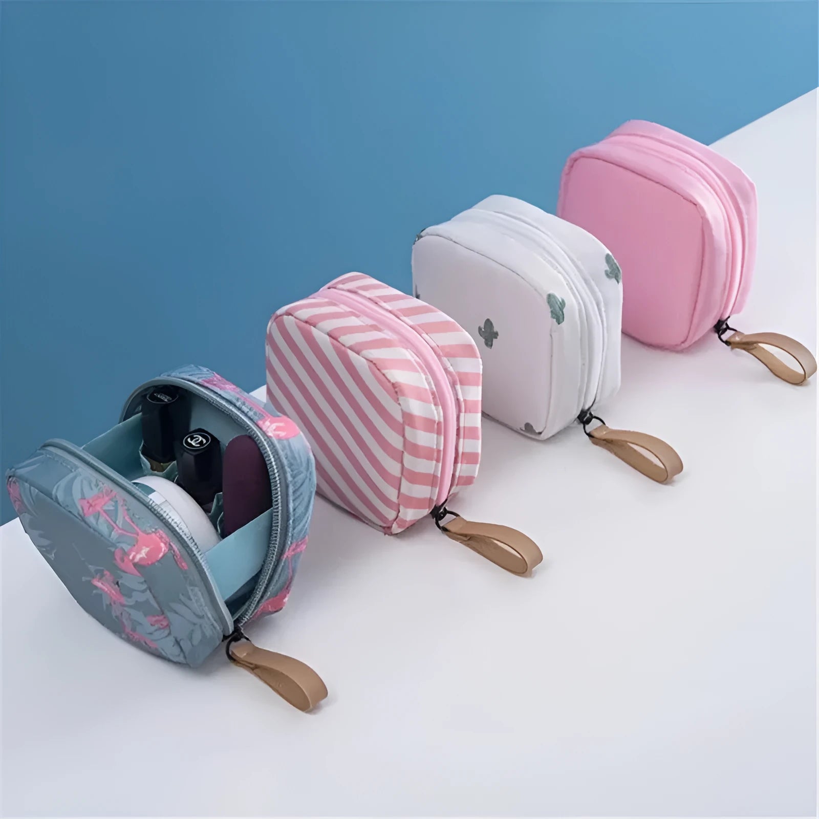 A blue cloth cube-shaped makeup storage bag sitting upright, showing its plain fabric design.