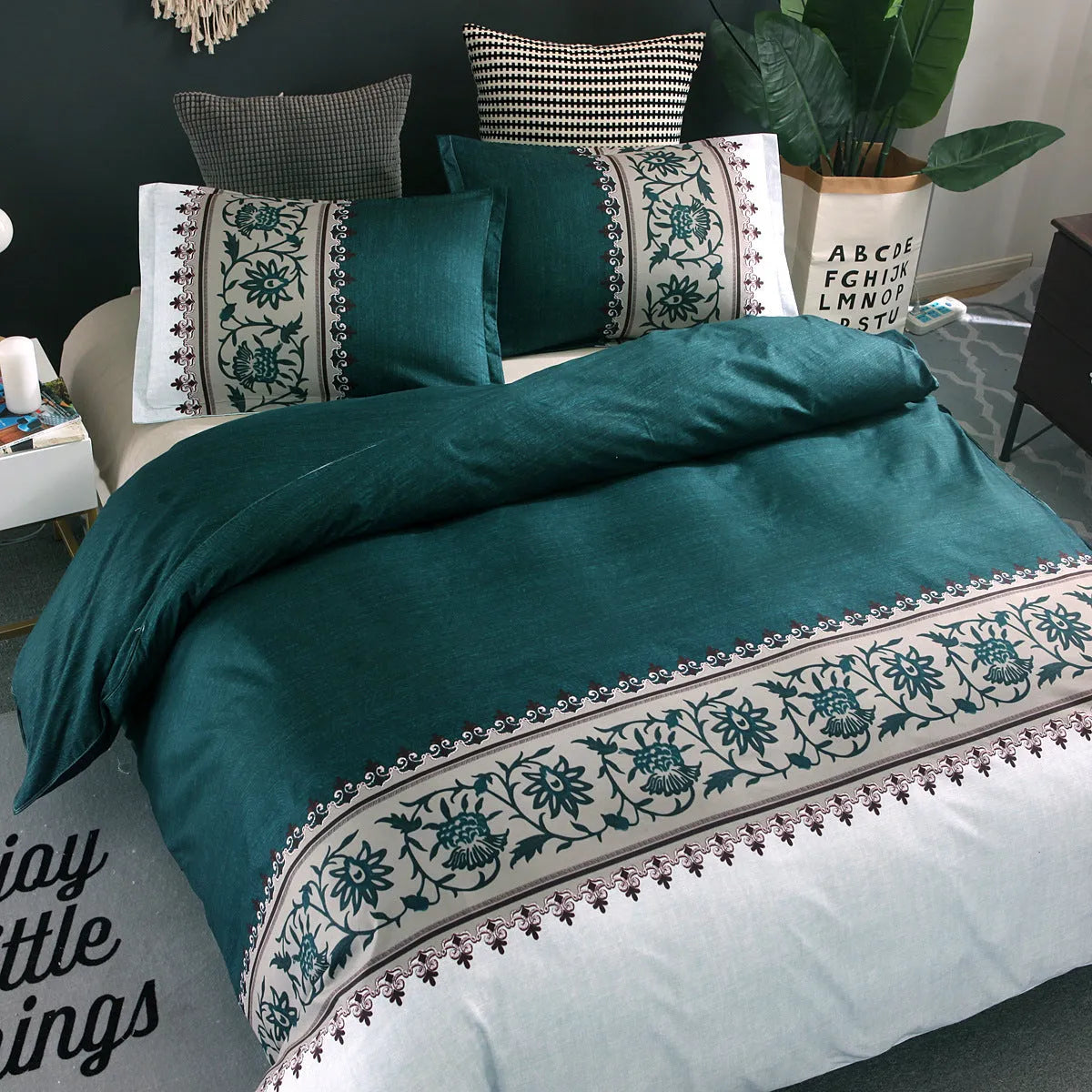 Polyester duvet cover set with plain weave reactive printing in peacock blue colour on a bed