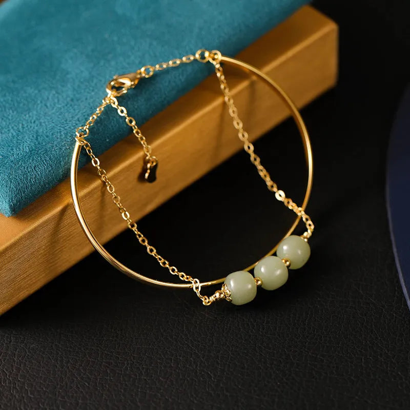 Women's Hetian jade lucky bead bracelet with gold inlay, showing single, double, and three bead version options.
